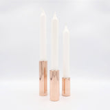 Blankpolerede kobberlysestager